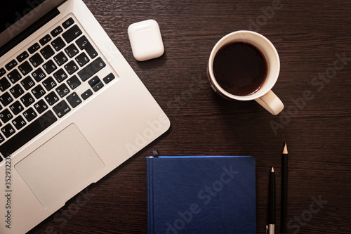 Notebook, pen, pencil and notebook on the table. Remote work.