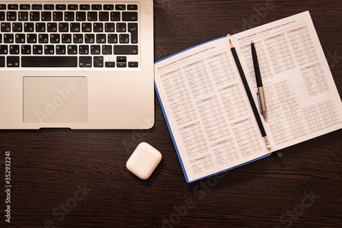 Notebook, pen, pencil and notebook on the table. Remote work.