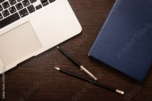 Notebook, pen, pencil and notebook on the table. Remote work.