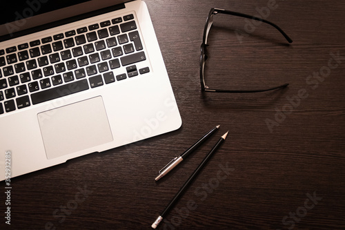 Notebook, pen, pencil and notebook on the table. Remote work.