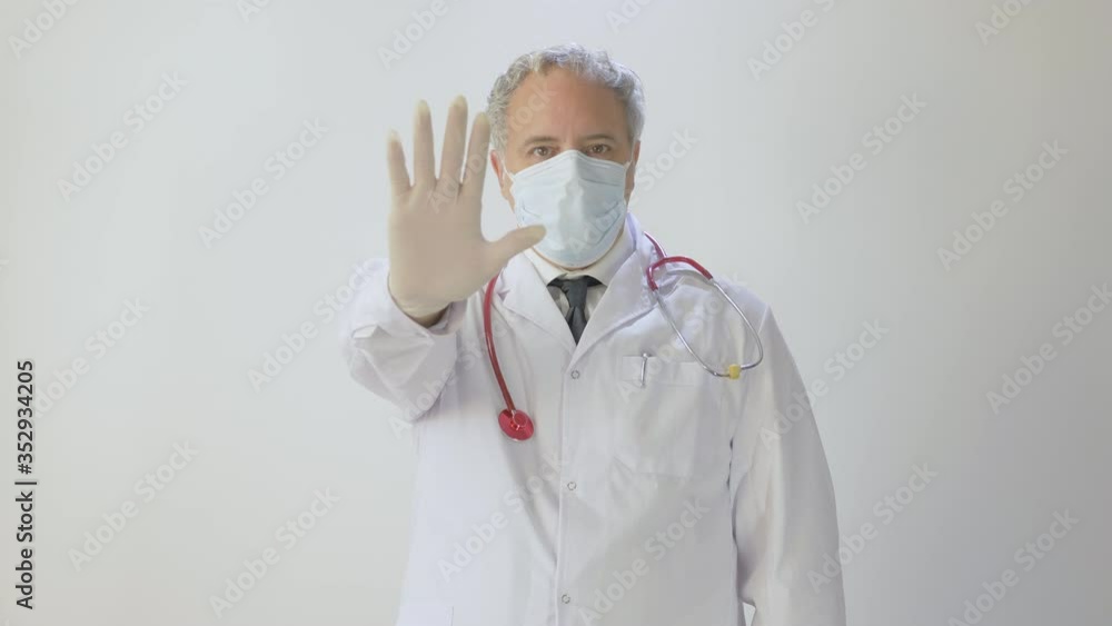 Doctor Medical Engineer Lab Worker With Mask And protective gloves Showing Stop Corona Virus Sign With Hand showing stop sign on hospital . Novel coronavirus 2019-nCoV COVID 19 MERS chinese infection Doctor Medical Engineer Lab Worker With Mask And protective gloves Showing Stop Corona Virus Sign With Hand showing stop sign on hospital . Novel coronavirus 2019-nCoV COVID 19 MERS chinese infection