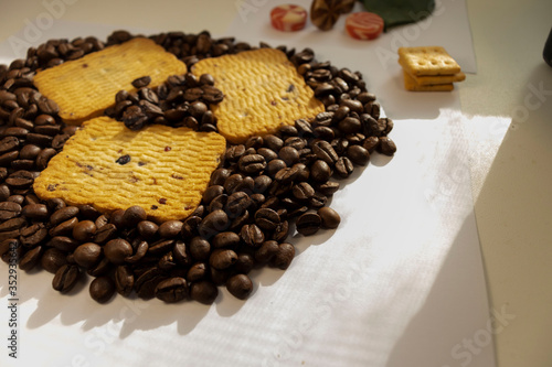Breakfast coffee cookies morning still life background coffee grain on a white background candy flowers roses