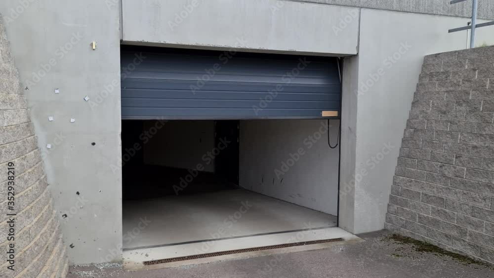 View of process of automatically closing of garage door. Modern technology concept. View of process of automatically closing of garage door. Modern technology concept.