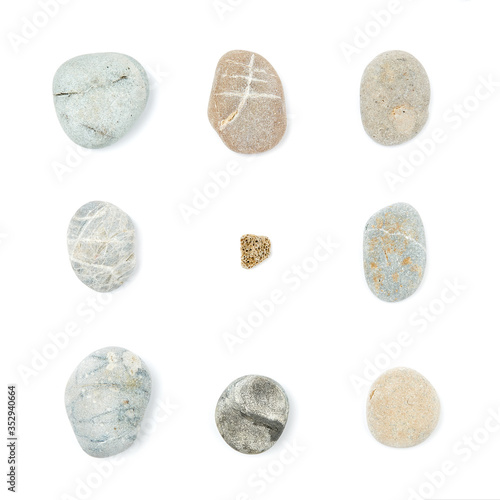 Mix of rounded multicolor textured stones forming square shape. Isolated on white background flat lay