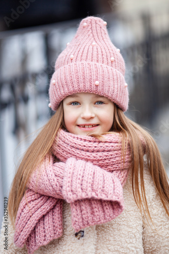 Girl wearing a winter hat and scarf