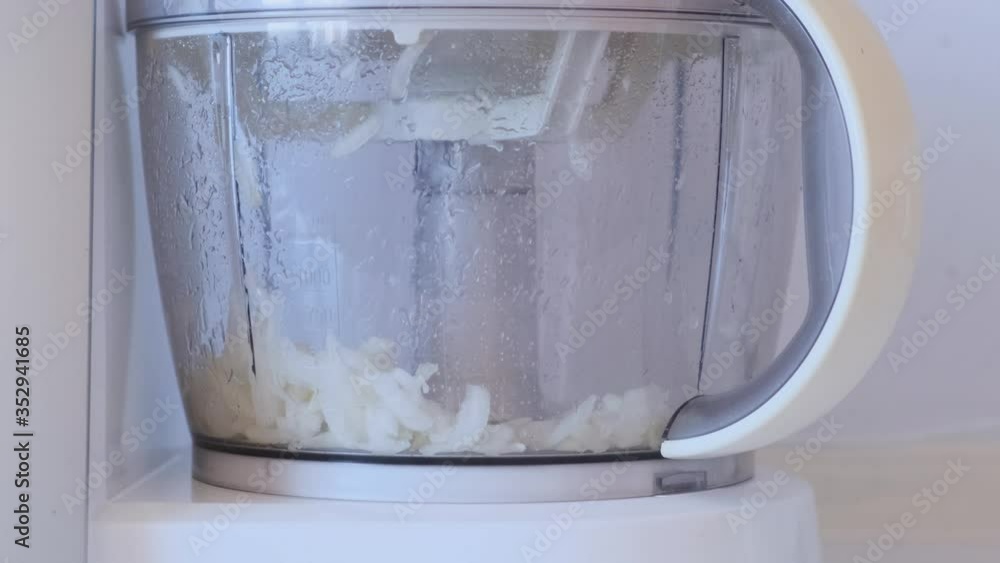 Chopped onions in a food processor. Cooking in a food processor. Chopped onions in a food processor. Cooking in a food processor.