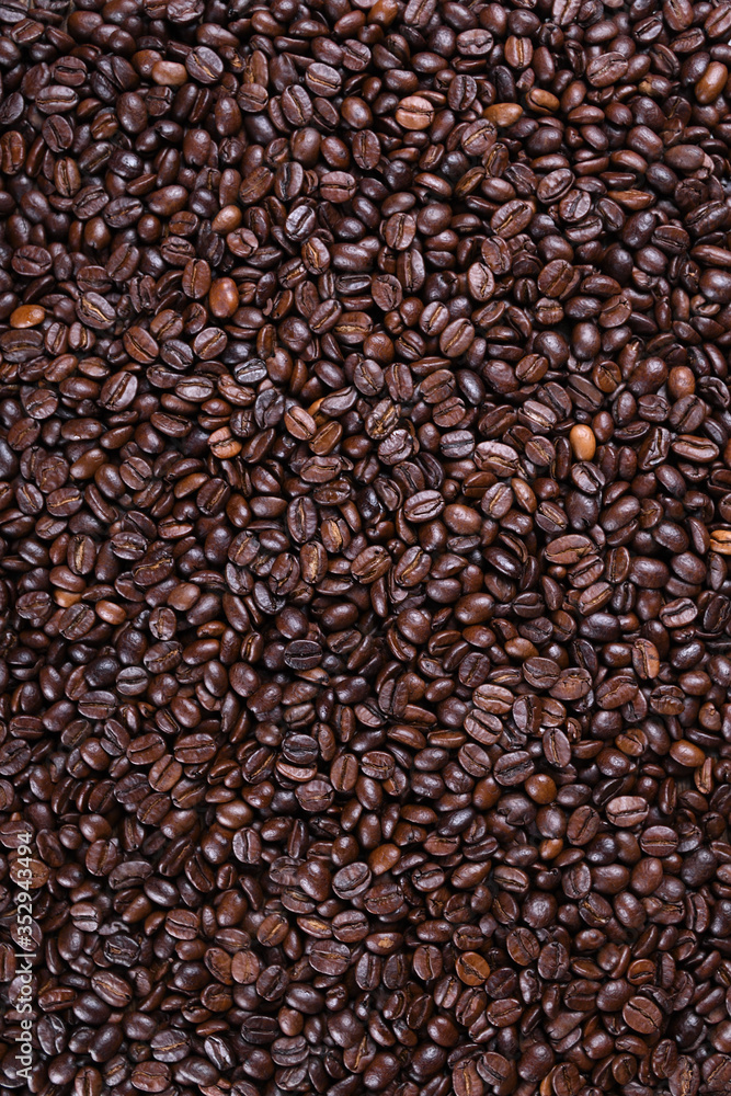 Fresh brown coffee beans texture of roasted ready to drink close-up. Fresh brown coffee beans texture of roasted ready to drink close-up.