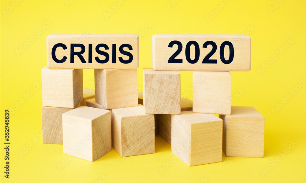 Obraz premium 2020 concept. Government economy improvings. Wooden blocks with coins, dollar, graphs laying on real money, panorama, copy space