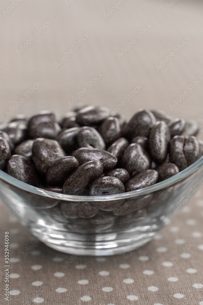 dried cranberries in chocolate in a glass bowl dried cranberries in chocolate in a glass bowl