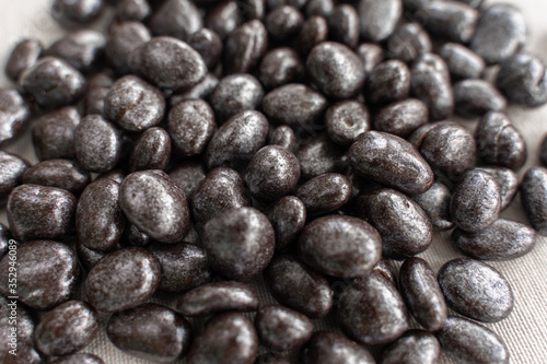 raisins in chocolate sprinkled closeup. chocolate background