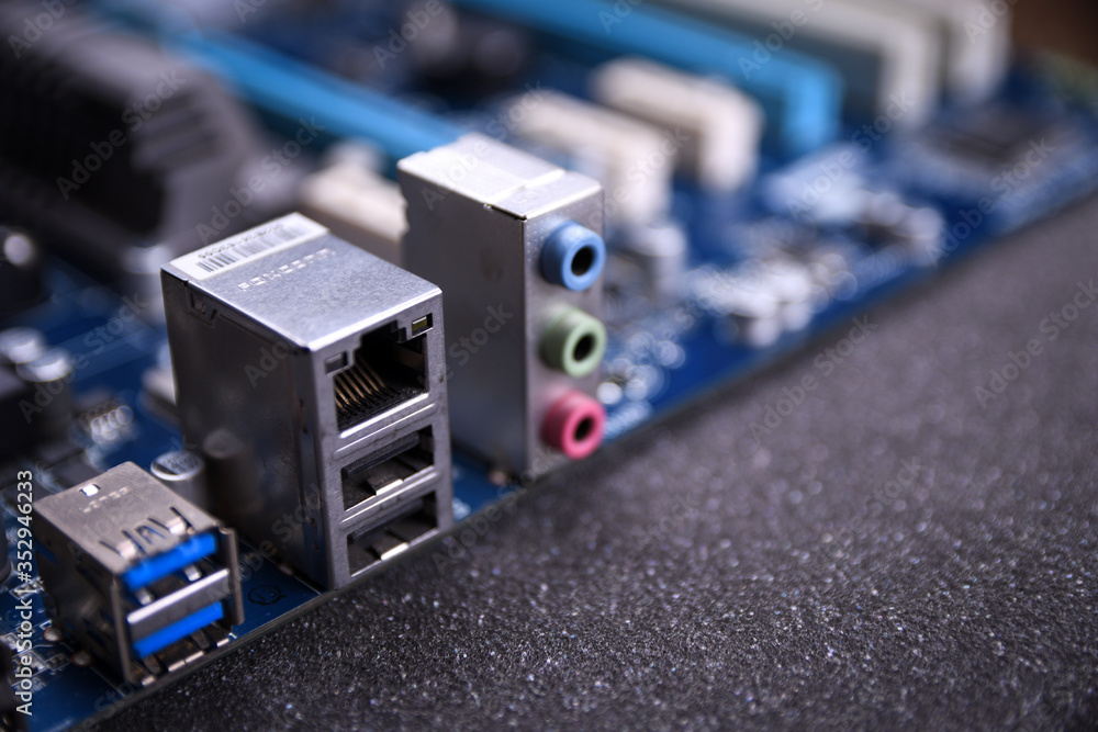 Computer motherboard and electronical components cpu gpu memory and different sockets for video card close up Computer motherboard and electronical components cpu gpu memory and different sockets for video card close up