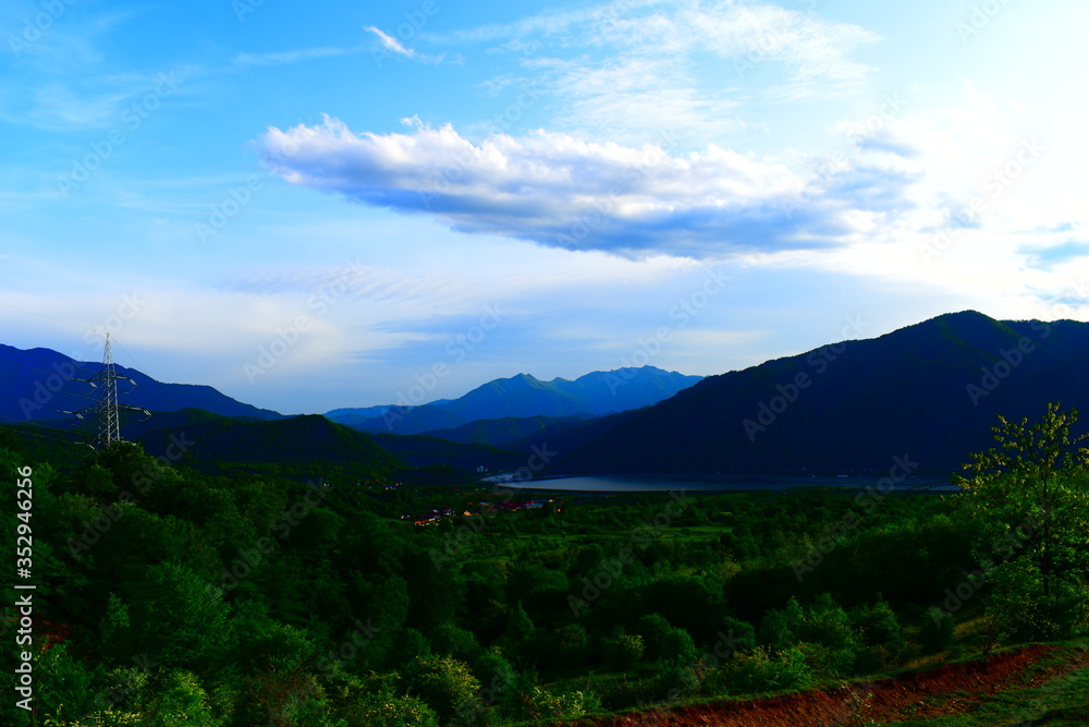 Naklejka premium mountain landscape with clouds