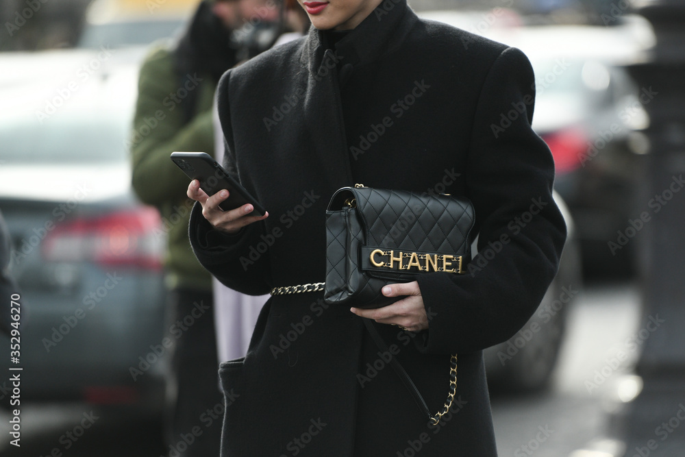 Paris, France – March 3, 2020: Woman wearing a Chanel black