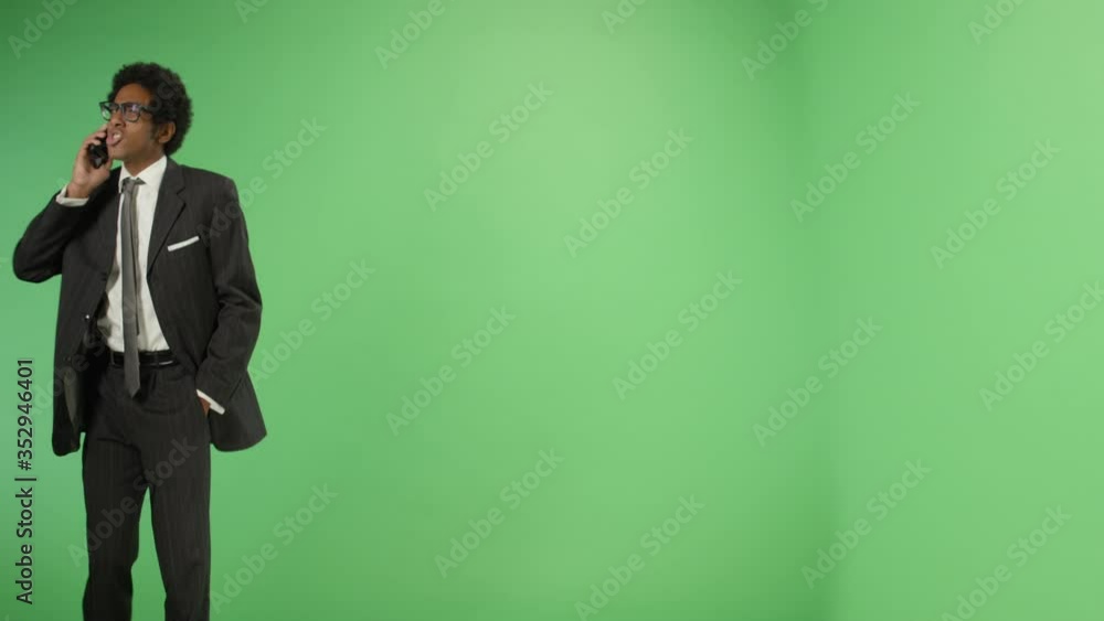 Angry Businessman talking on phone with green screen Angry Businessman talking on phone with green screen
