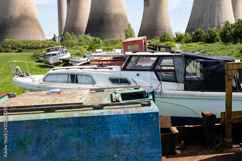 Old derelict boats in a field photo