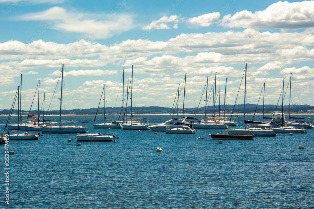 Boats at the sea with blue sky and water