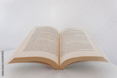 reading an open book on white background