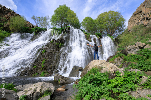 man and Shaki waterfal