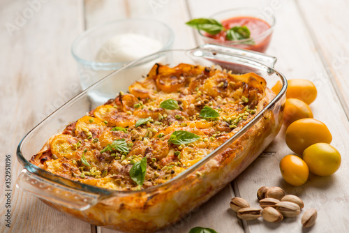 lasagne with mozzarella fresh tomatoes and pistachio nuts