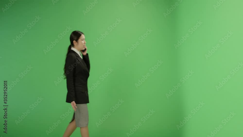 Angry Businesswoman Walking and Talking on Phone Angry Businesswoman Walking and Talking on Phone