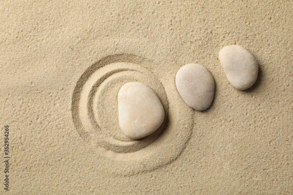 Stones on the sand with patterns. Zen concept Stones on the sand with patterns. Zen concept