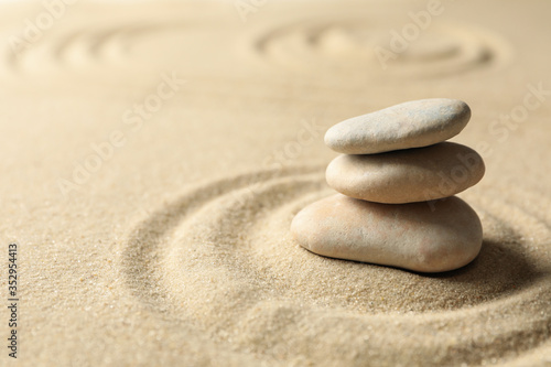 Stones on the sand with patterns. Zen concept