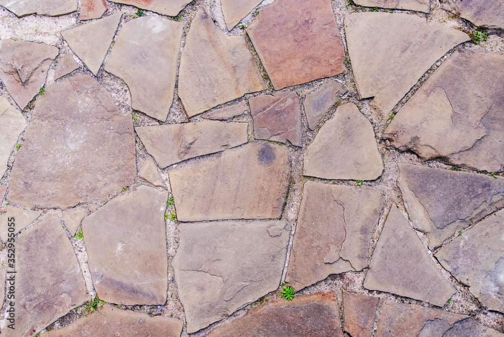 Obraz premium Decorative pavement tiles sandstone background