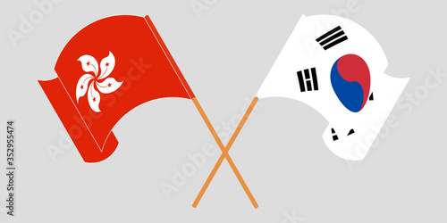 Crossed and waving flags of Hong Kong and South Korea