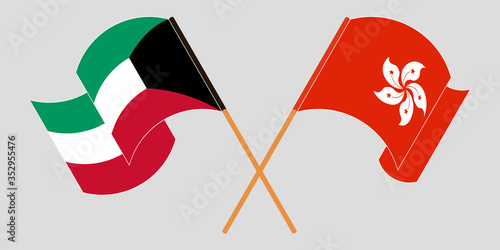 Crossed and waving flags of Hong Kong and Kuwait
