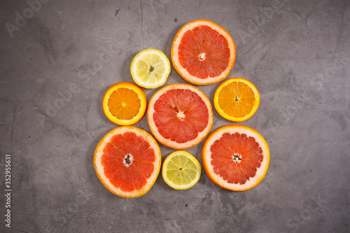 Slices of citrus fruits on the table © Long Frame