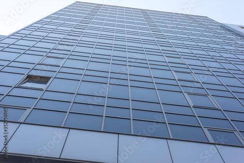 Bottom view landscape of skyscrapers. Architecture of office buildings  hotel. Many windows  floors of a multi-storey building.