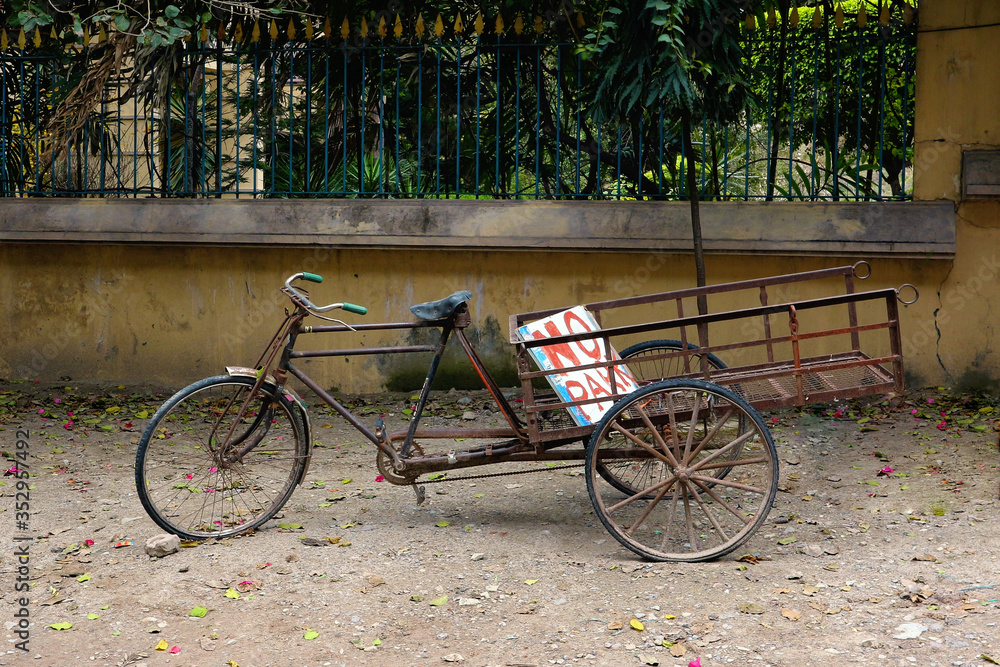 A bicycle trolley with the sign 