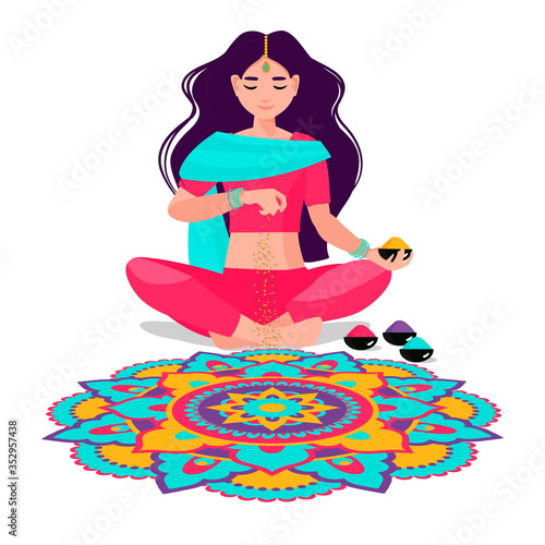 an Indian woman sits and makes rangoli from powders, chalk, marble dust, rice flour. The traditional picture of happiness on holiday Diwali