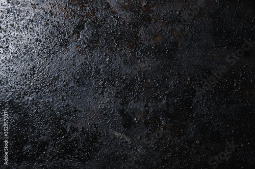 Obraz na płótnie Black isolated textured background photographed with studio light. w salonie
