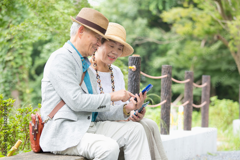 Senior couple looking at smart phone Senior couple looking at smart phone