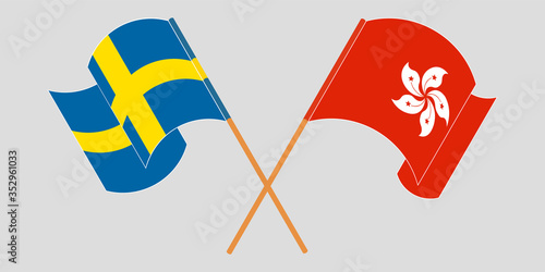 Crossed and waving flags of Hong Kong and Sweden