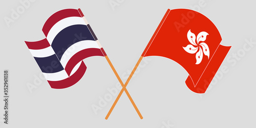 Crossed and waving flags of Hong Kong and Thailand