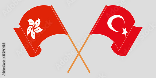 Crossed and waving flags of Hong Kong and Turkey
