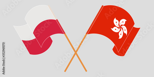 Crossed and waving flags of Hong Kong and Poland