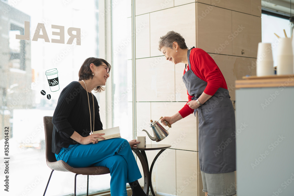 Shop clerk attending regular customer Shop clerk attending regular customer