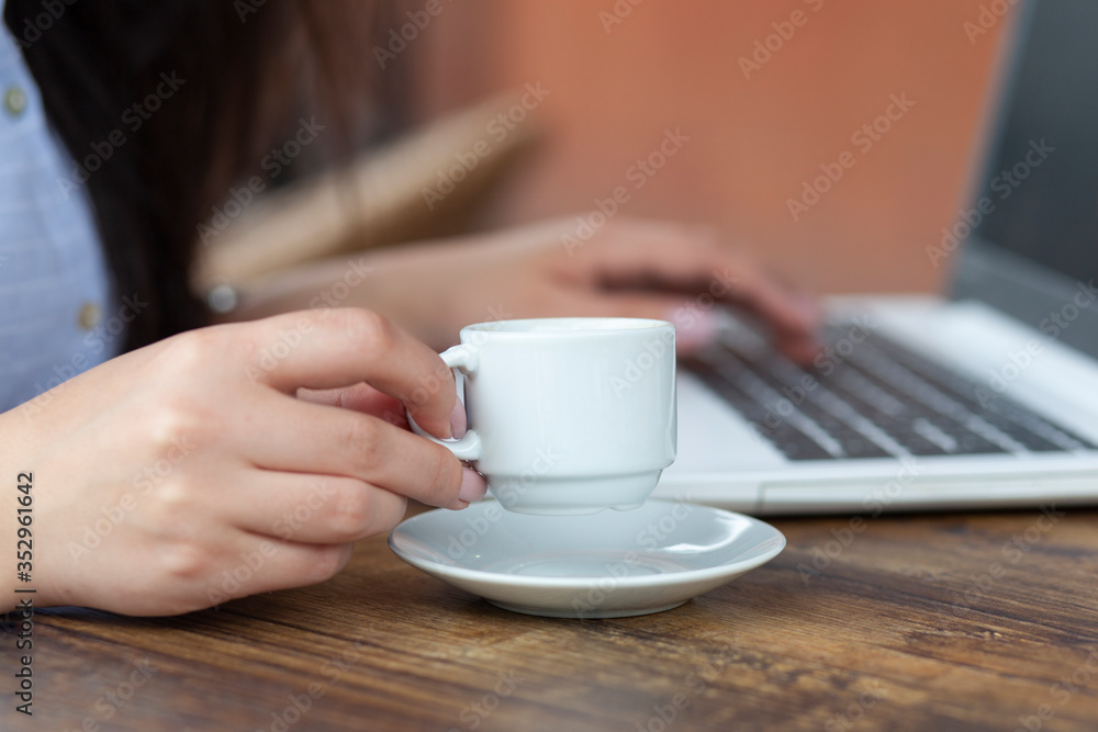woman hand coffee and computer in street cafe woman hand coffee and computer in street cafe