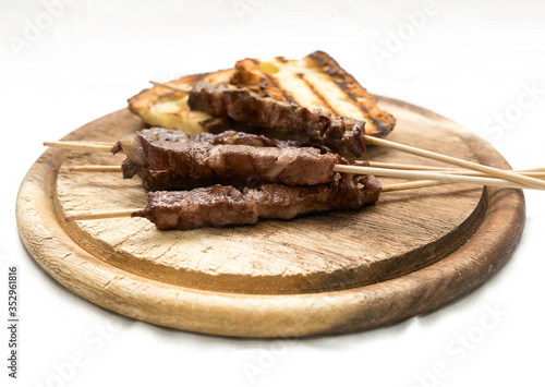 Arrosticini and bruschetta bread: typical Abruzzese dish
