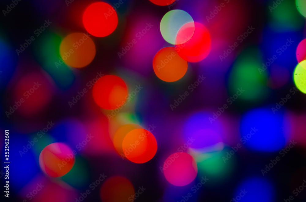 abstract background of blurred warm lights with cool blue and purple background with bokeh effect