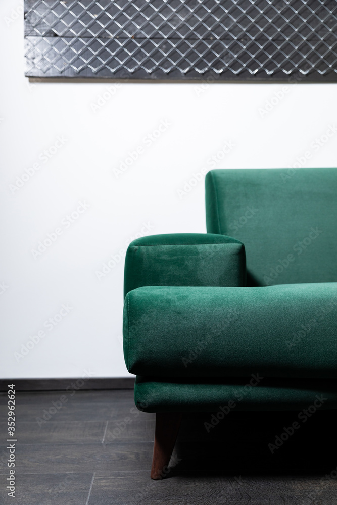 Green Sofa in the room with white walls