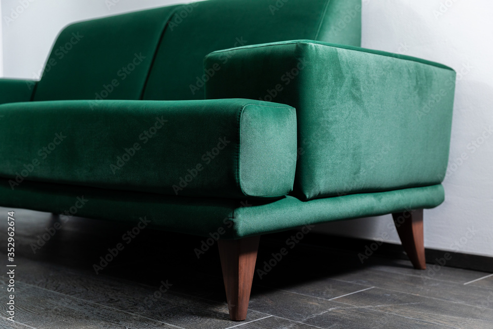 Green Sofa in the room with white walls