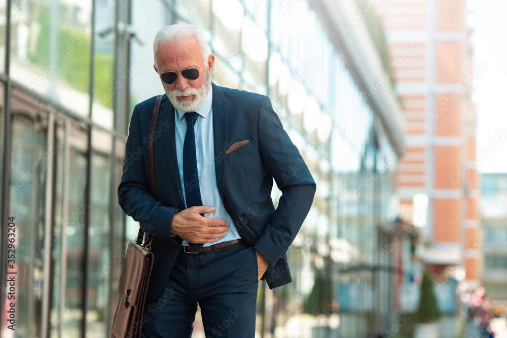 Senior business man have pain in stomach Senior business man have pain in stomach