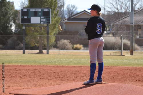 Youth baseball pitcher on the mound photo
