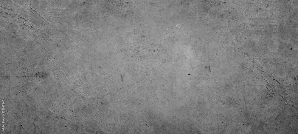 Grey or gray textured cement or concrete wall background Grey or gray textured cement or concrete wall background