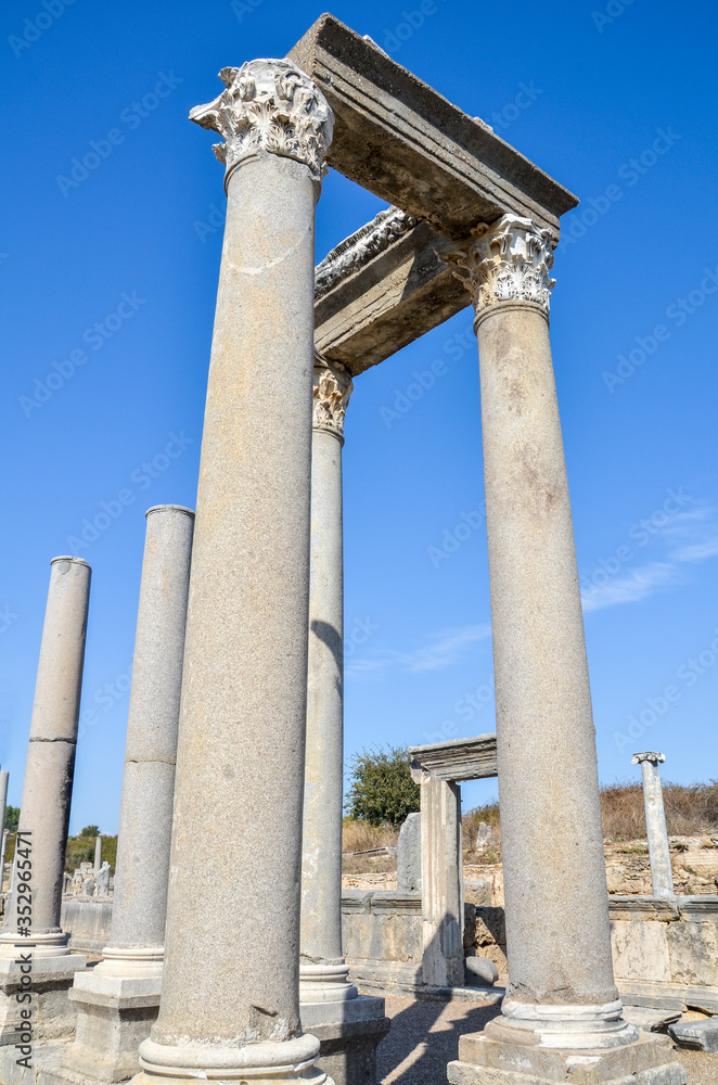 Row of marble columns in the ancient roman city of Perge located near the Antalya city in Turkey.
