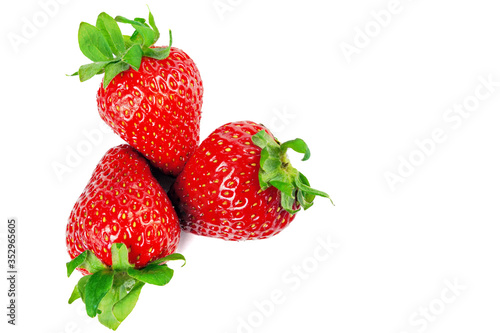 Fototapeta Naklejka Na Ścianę i Meble -  three strawberries on a white background